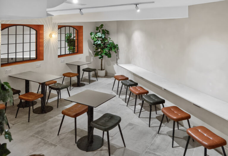 Basement customer seating area at En Route Farringdon